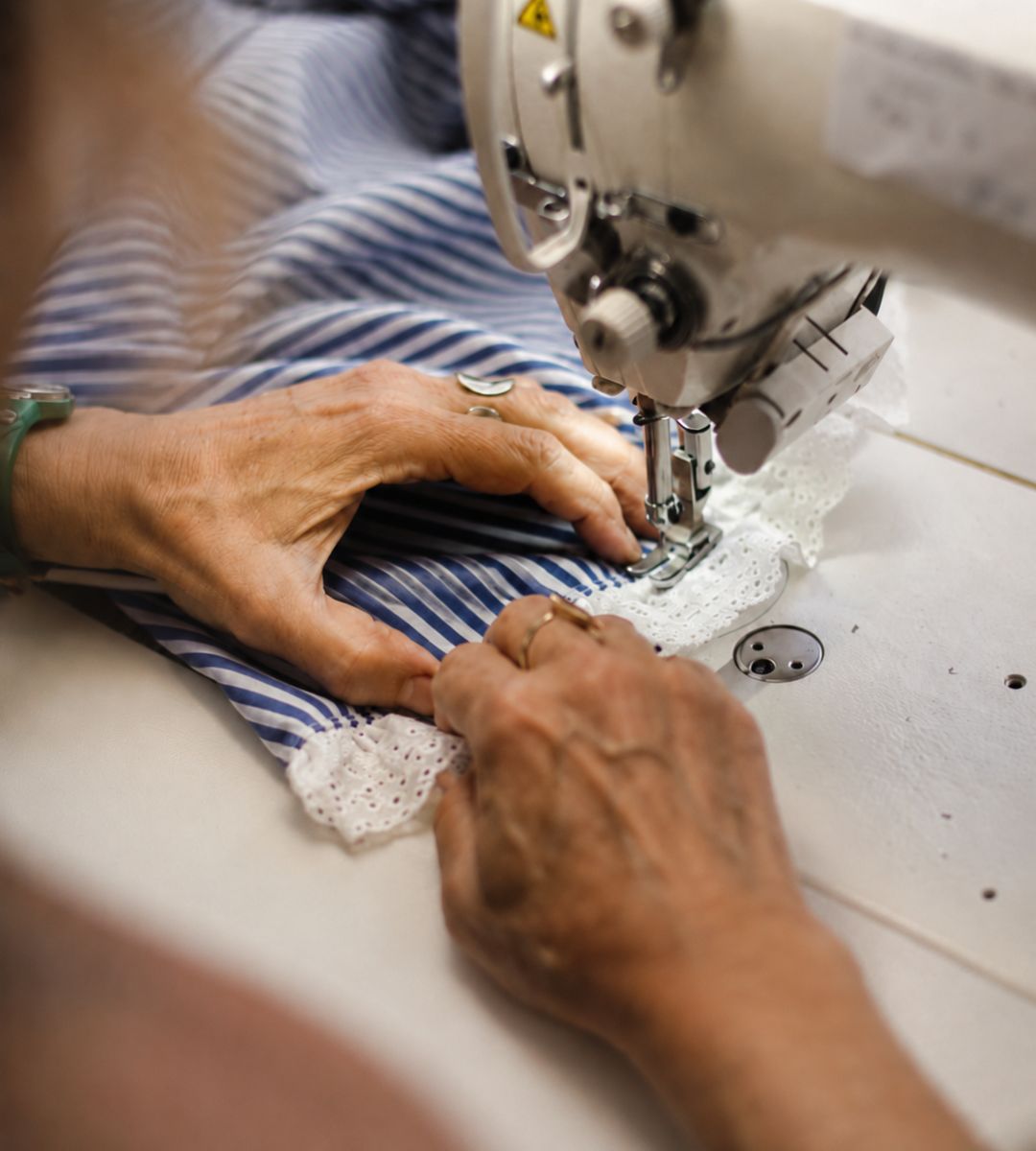 Hands at a sewing machine